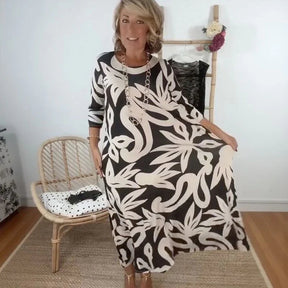 Vestido Mídi Longo Nerina™ com Estampa Floral Abstrata / A Elegância Solta que Inspira Liberdade!